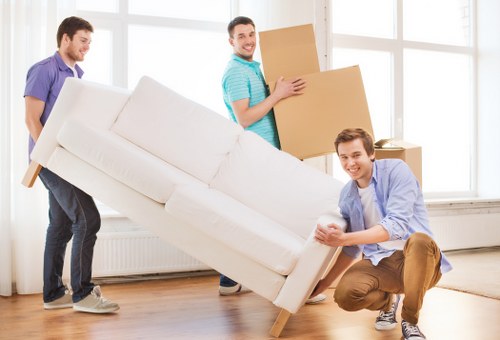 Packed office boxes and business equipment ready for a commercial move in Wimbledon