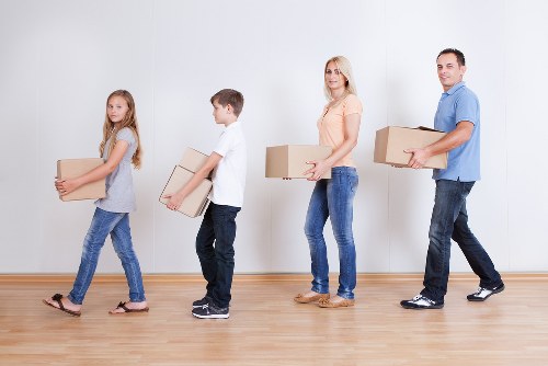 Removal van and moving crew assisting a local Wimbledon relocation