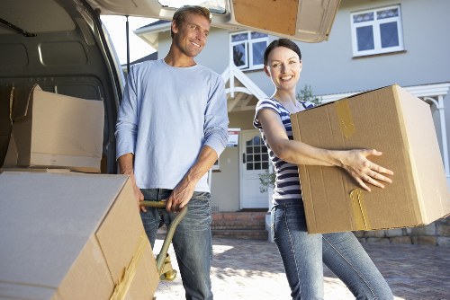 Loading furniture into a removal truck in Wimbledon