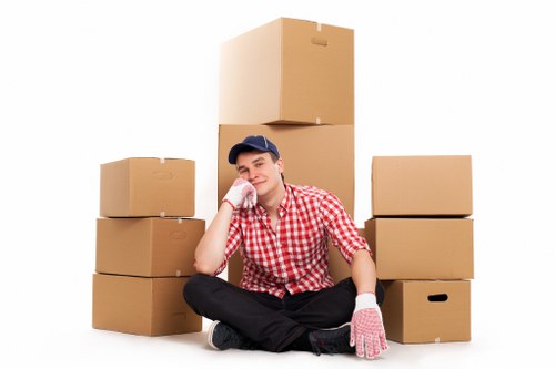 Packed boxes and furniture prepared for loading into a moving van
